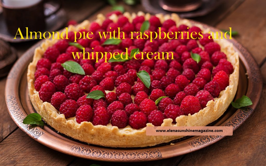 Almond pie with raspberries and whipped cream