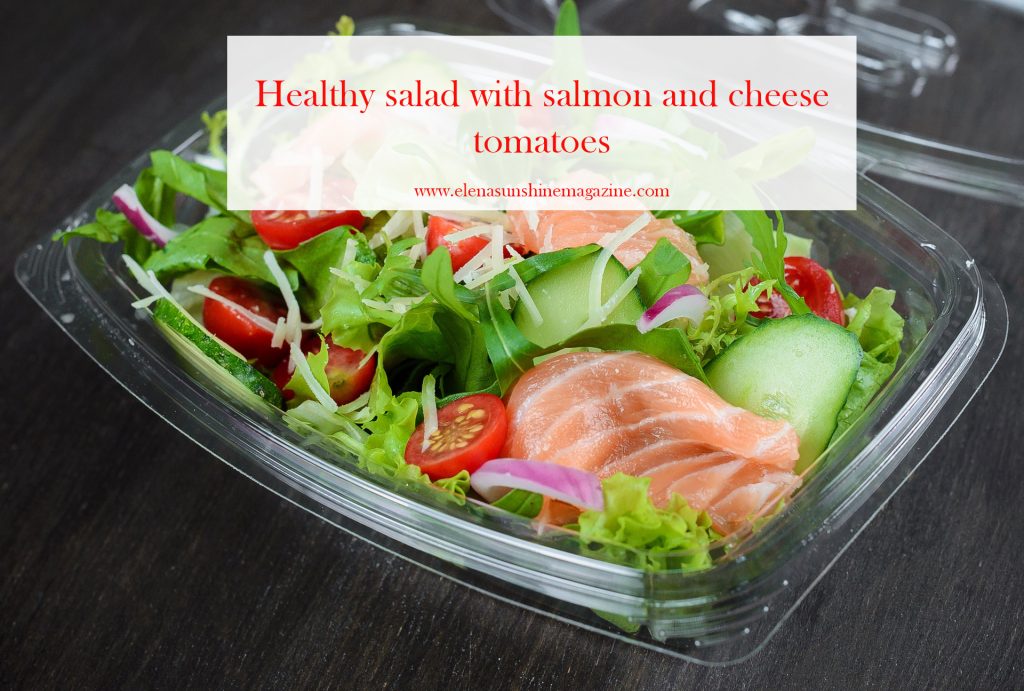 Healthy salad with salmon and cheese tomatoes