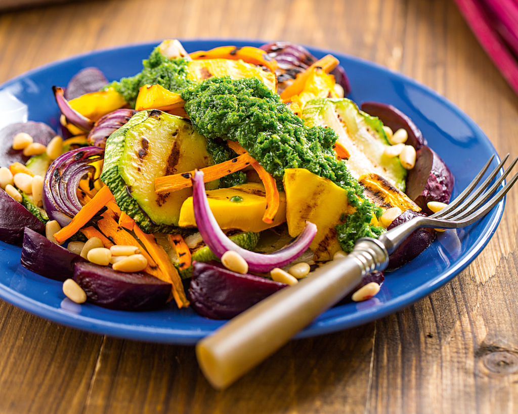 Warm summer pumpkin salad with zucchini and oregano