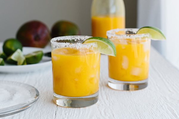 Mango-orange cocktail with turmeric