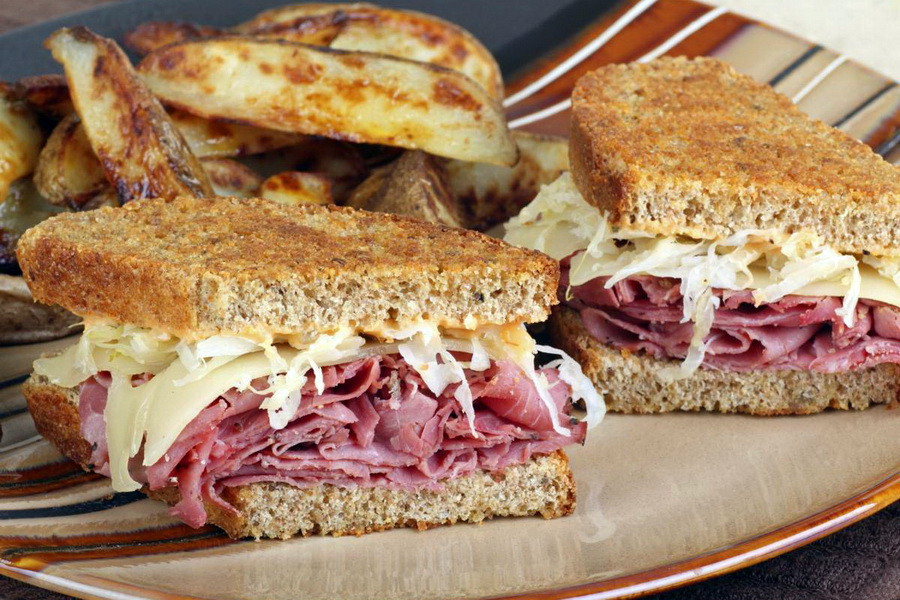 Open sandwich with pastrami cream cheese and artichokes