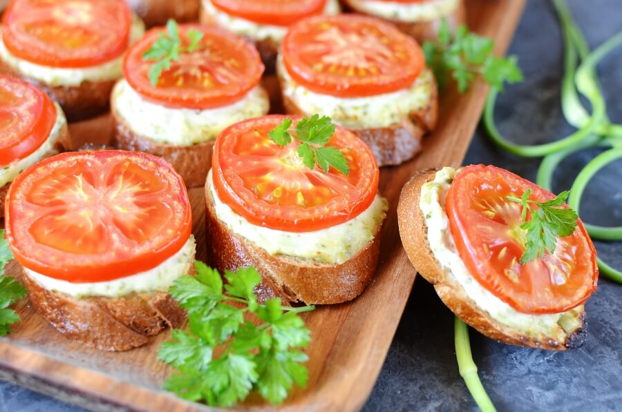 Sandwiches with cheese and cucumber spread and tomatoes