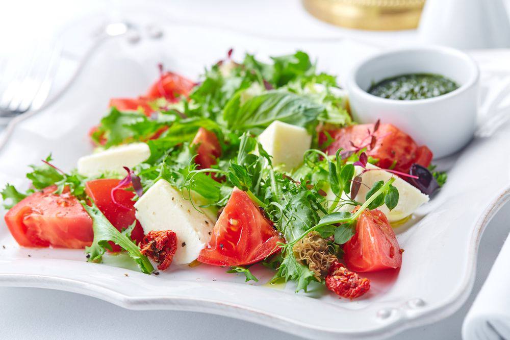 Salad with micro-greens, cheese and tomatoes