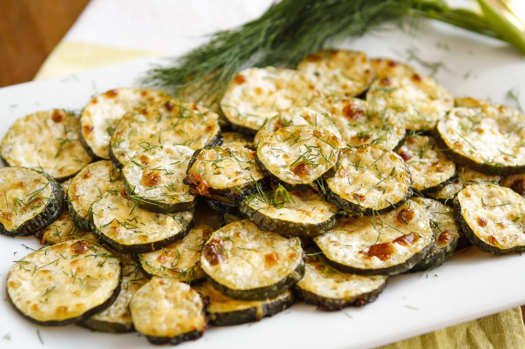 Zucchini with cheese, nuts and rosemary