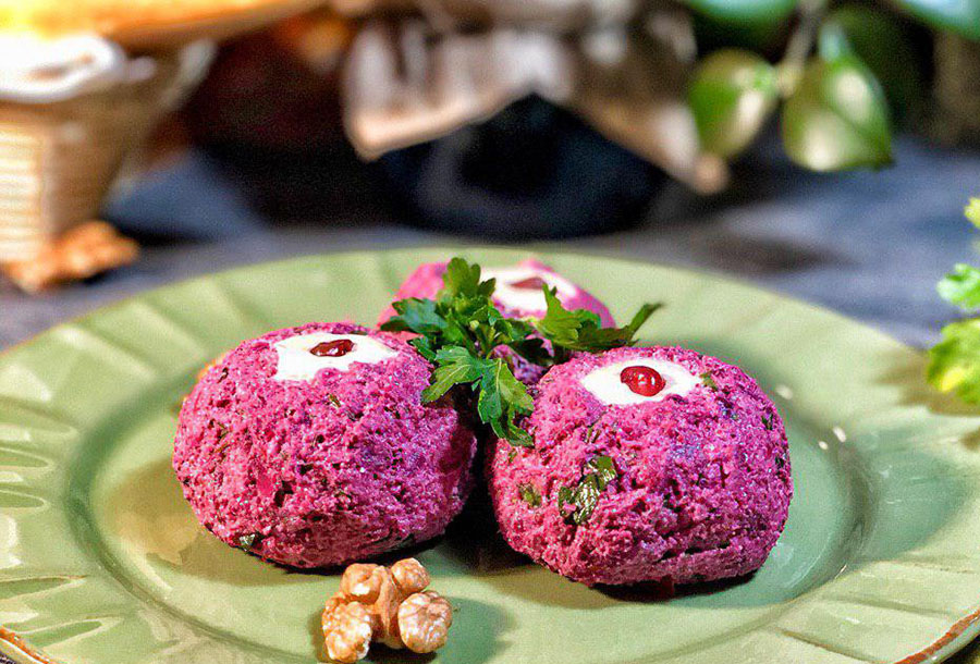 Snack beetroot balls with herring, cheese and eggs