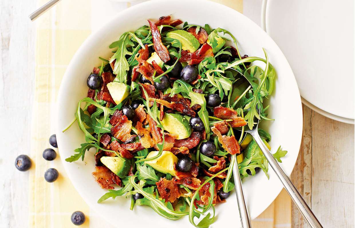 Arugula salad with blueberries, seeds and citrus dressing