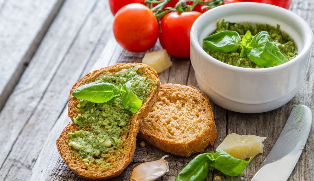 Bruschetta with green olive paste with basil