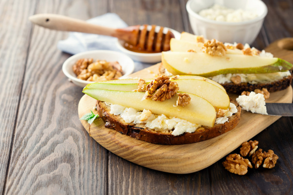 Toasts with cheese filling, pears and nuts