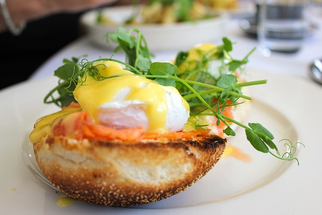 Toast with avocado, salted salmon, and poached egg